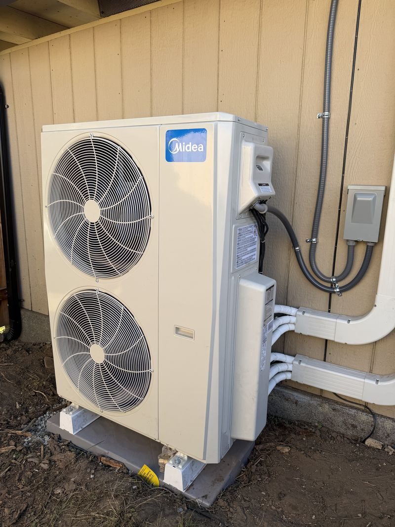 Midea air conditioning condenser installed by Northwest Thermal Solutions